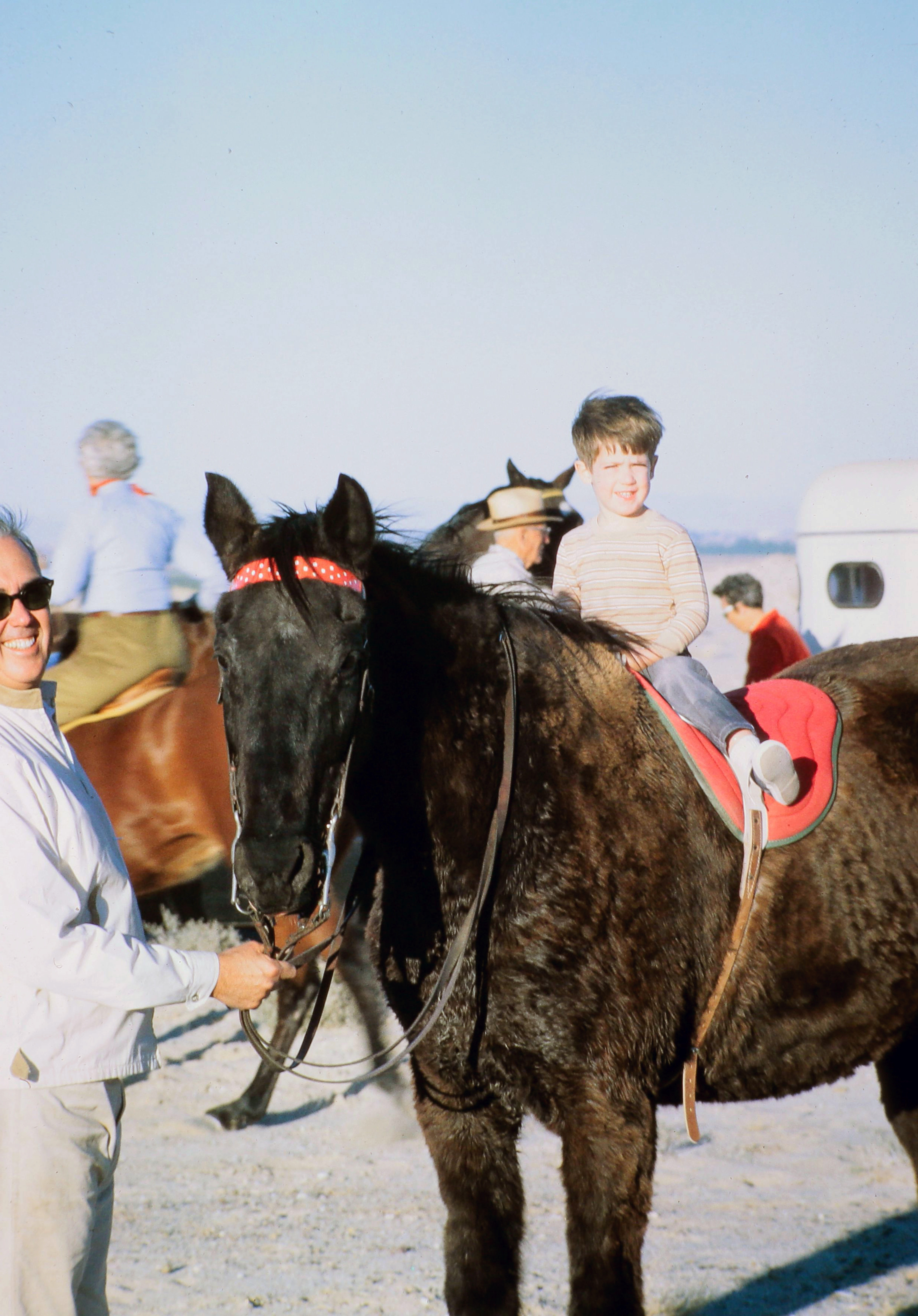 Fred (~5) on a horse, Gramp holding the reins — Imperial Valley desert, est. 1970–73