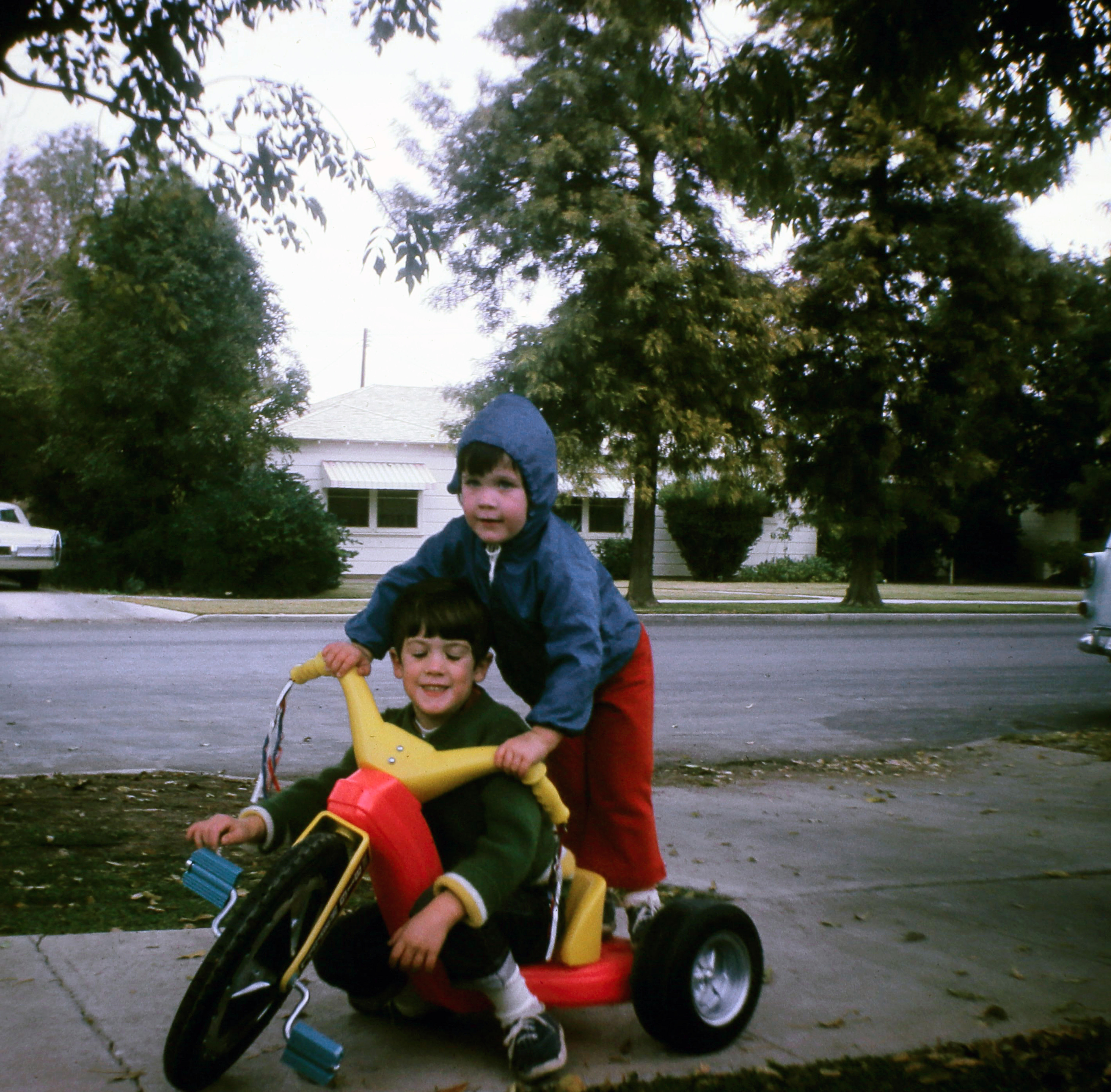 Fred on the Big Wheel, Amy on the back. El Centro, est. 1973–1975.