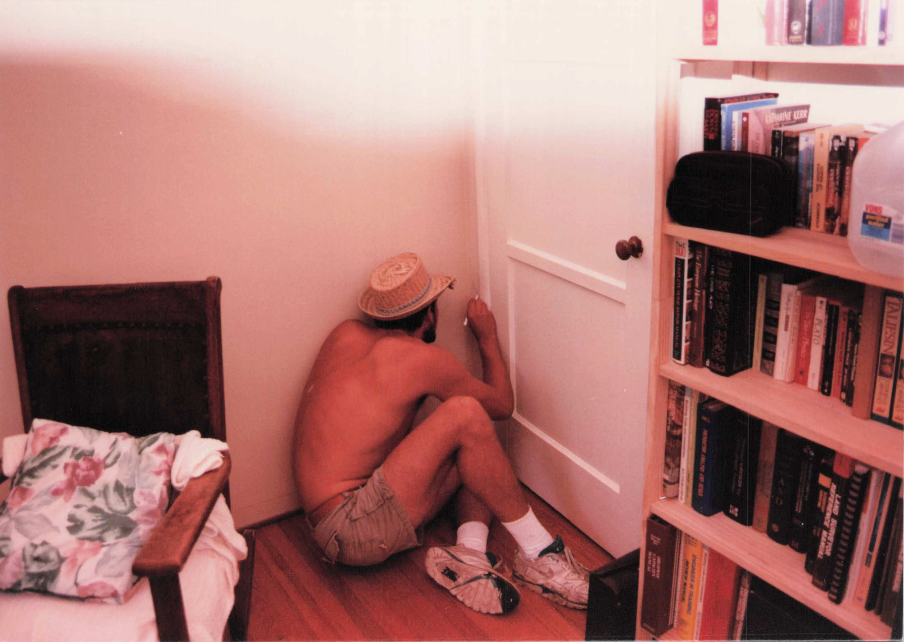 Ault, back to camera, in the room he'd just painted.