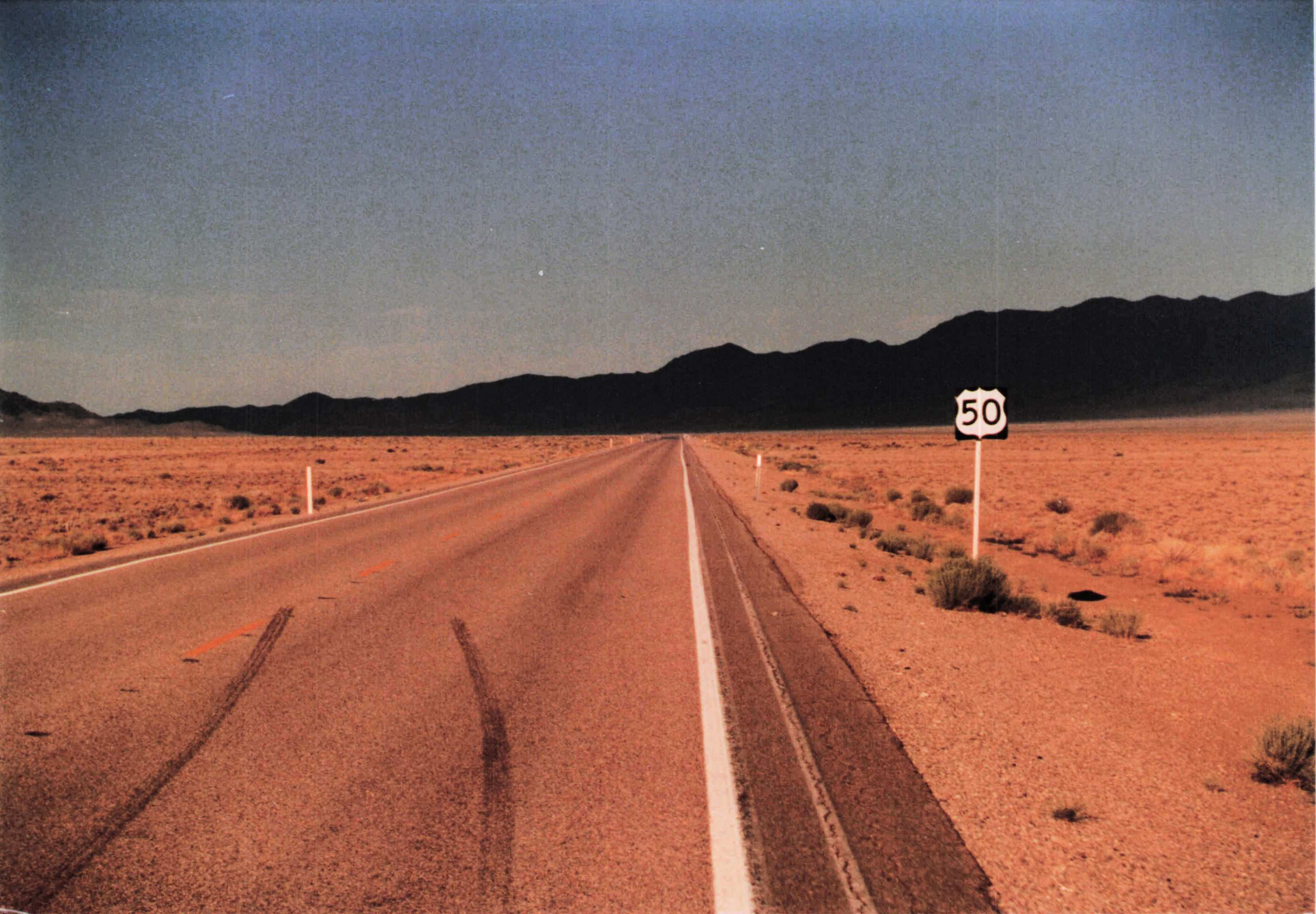 US Route 50, Nevada — the road vanishing to mountains