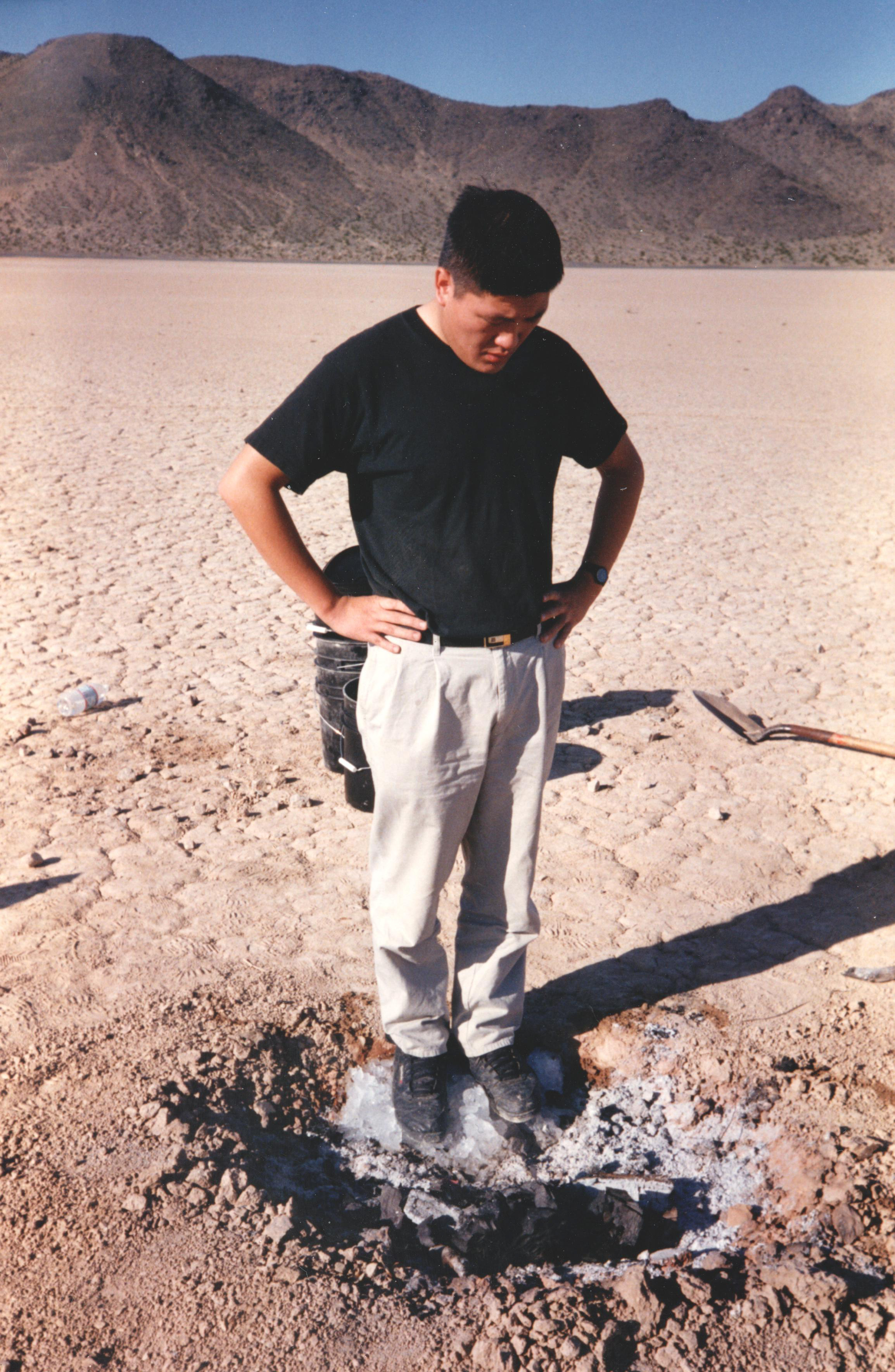 Minsoo Kang at the dead campfire on the dry lake playa