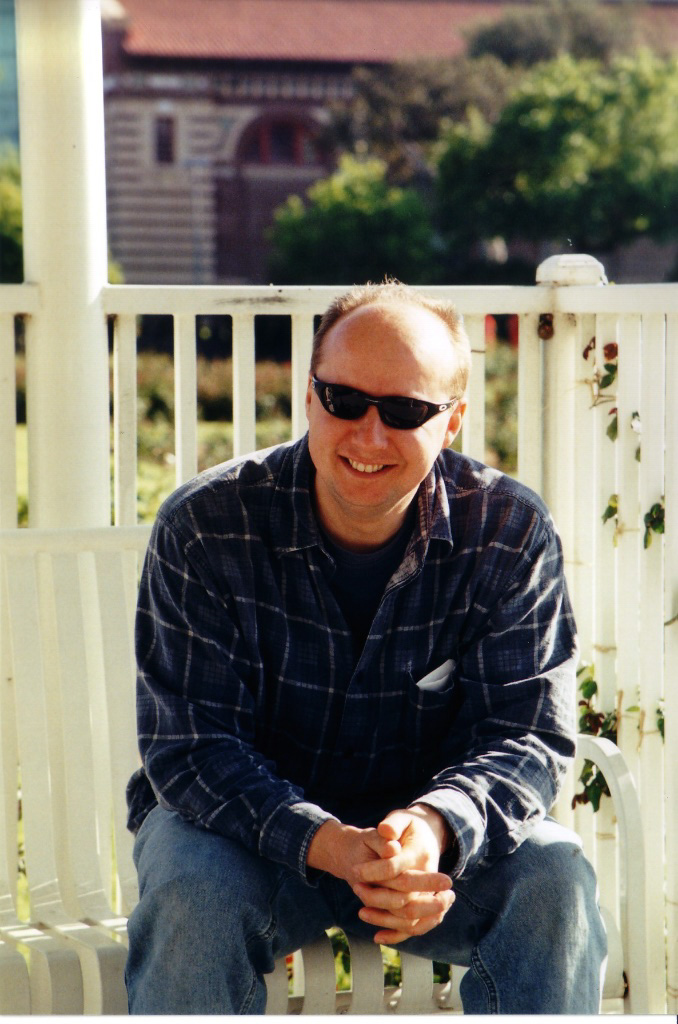 Ken Little (Doofs) on a porch bench near LACMA, 2002-06-03