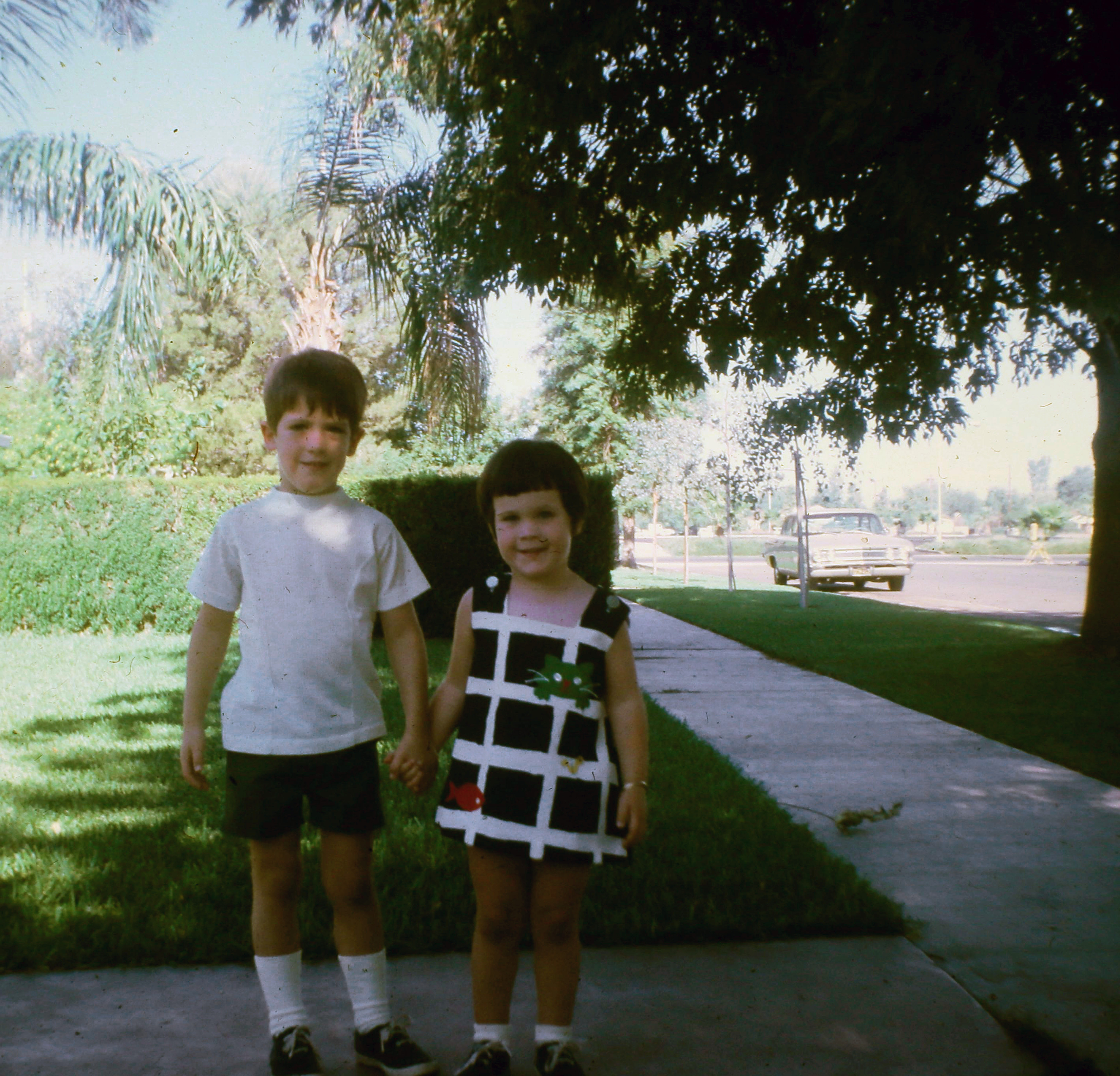 Amy and Fred on a suburban sidewalk in El Centro, est. 1971–1972