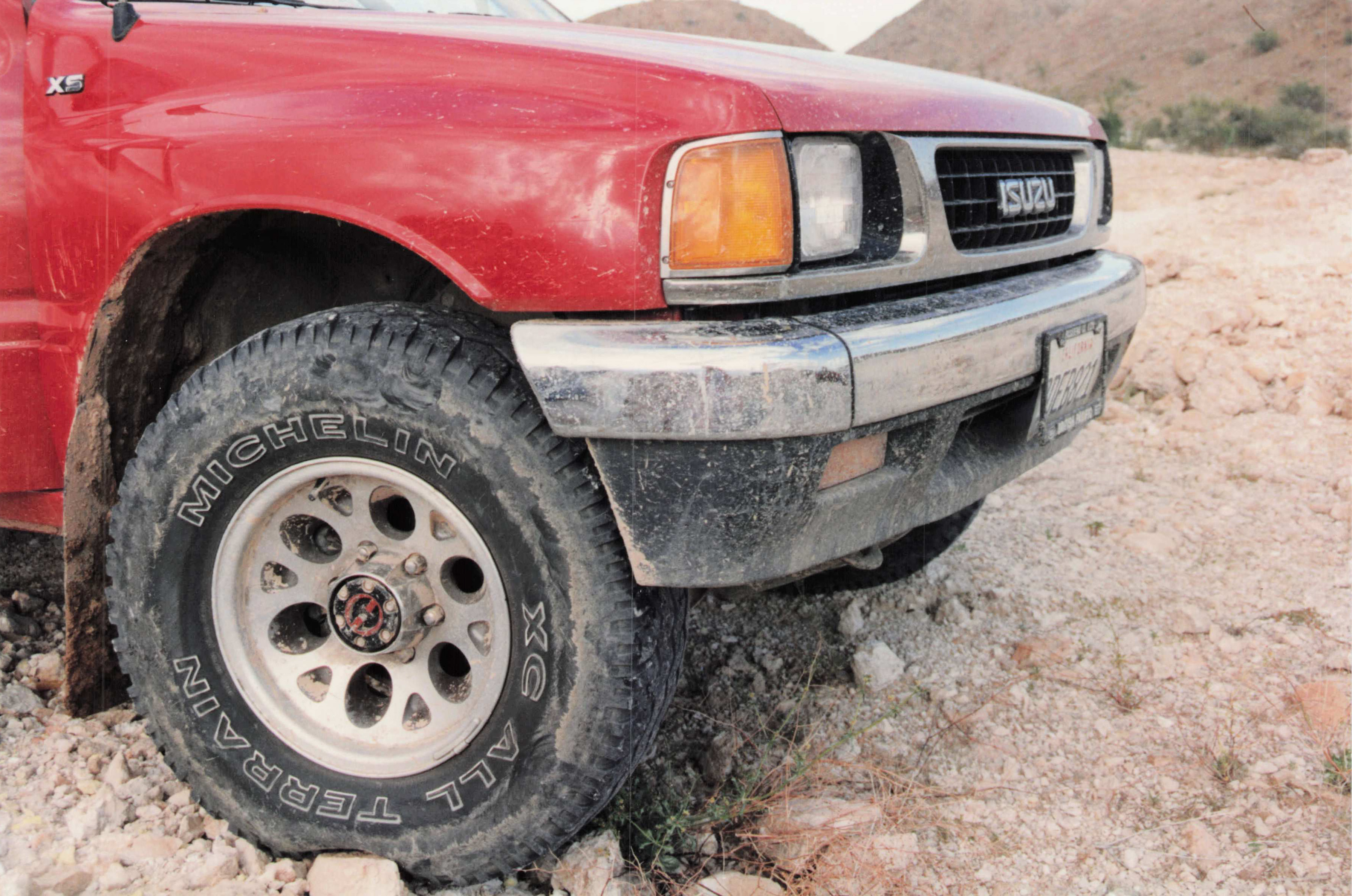 Red Isuzu Amigo in a Baja arroyo, circa 1994–1996