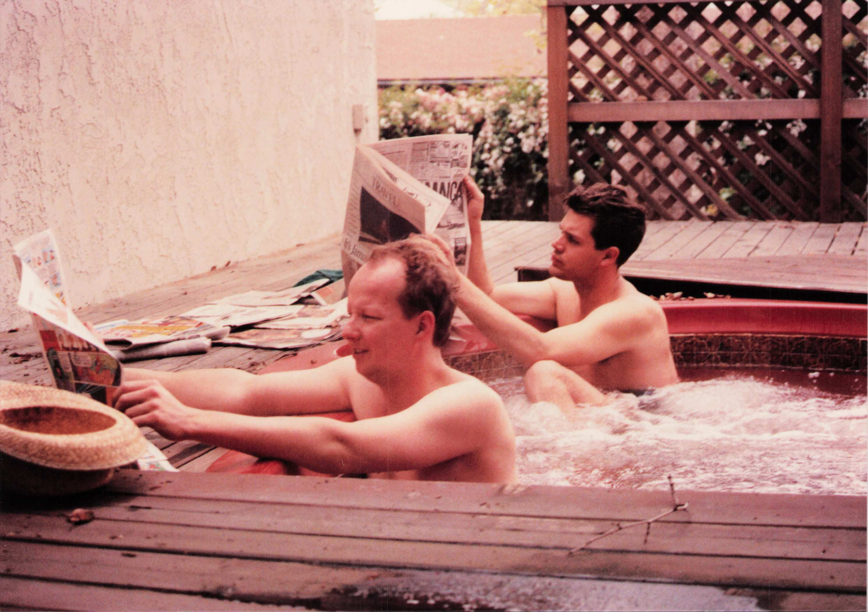 Ken (front) and Ault (rear) reading newspapers in hot tub. One of Fred's favorite photos.