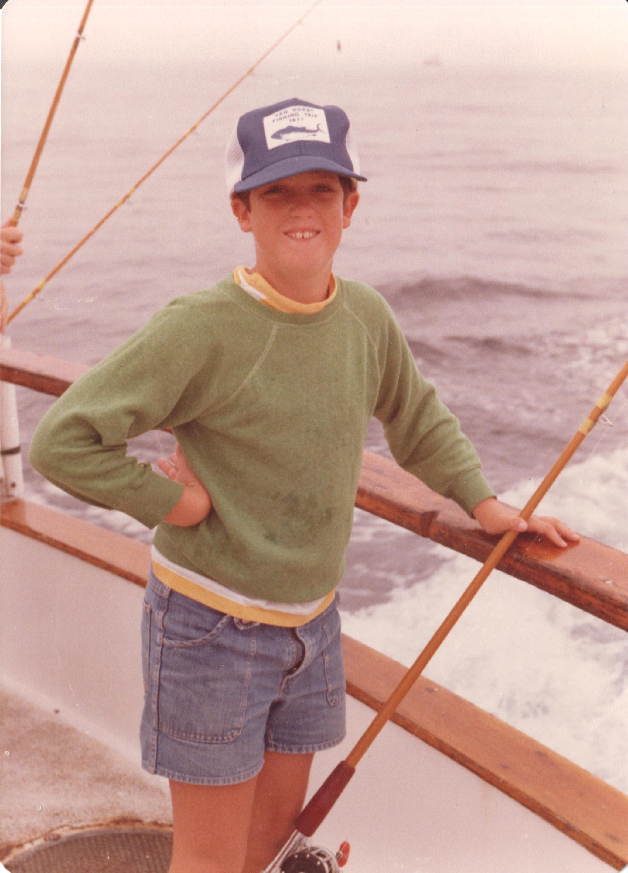 Young Fred on the Van Vorst sport fishing charter — swordfish cap, grinning