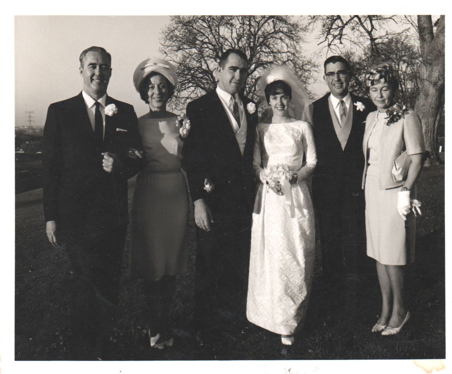 Elise and Phil's wedding, January 1964 — Grampa Jim is the tall man in glasses to the right of the bride; Sarah, his former wife, stands at far right