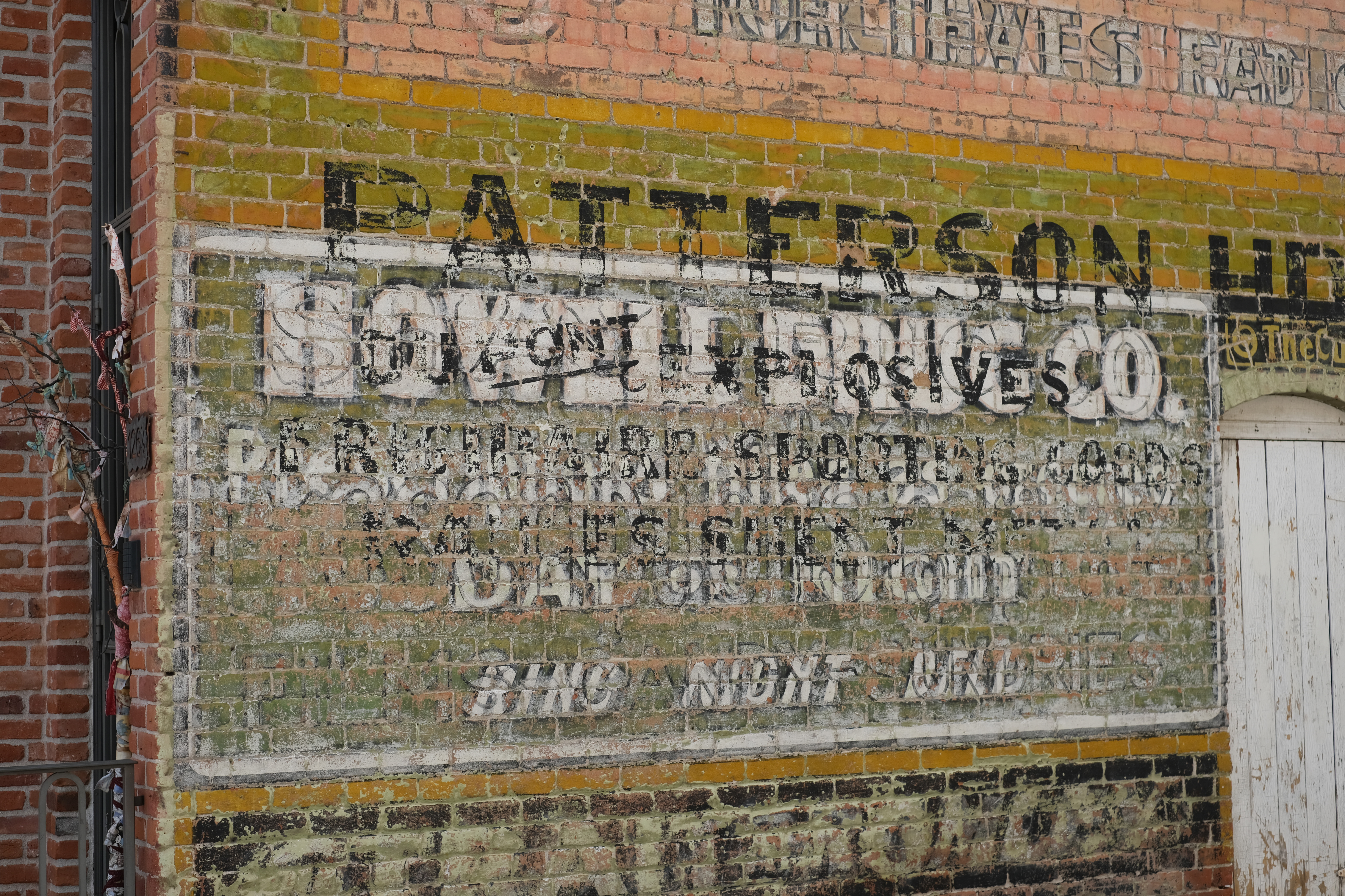 A weathered, layered ghost sign in Turret, the one-building ghost town up canyon from Salida.