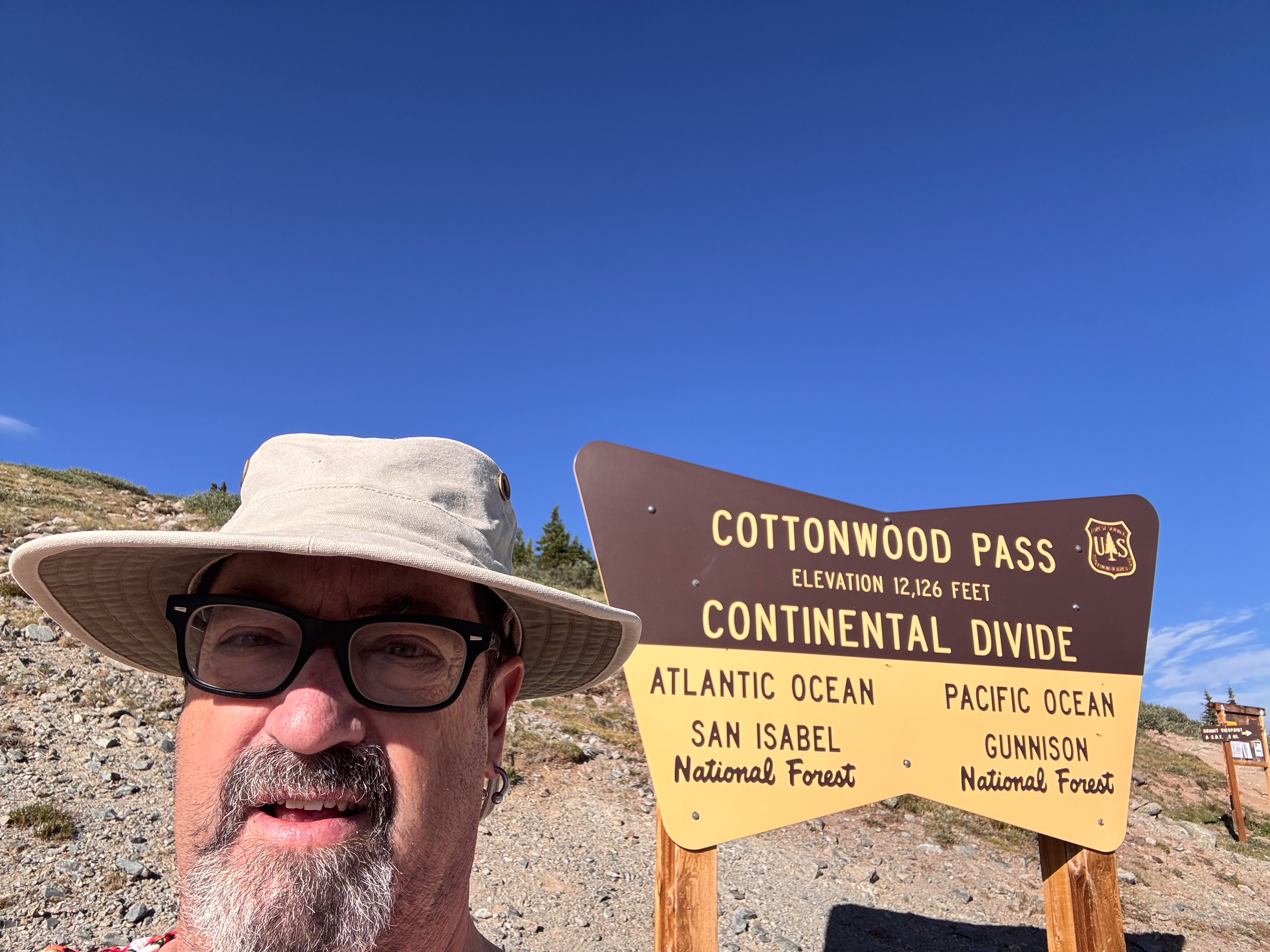 Fred at the Cottonwood Pass sign, Continental Divide, 12,126 feet.