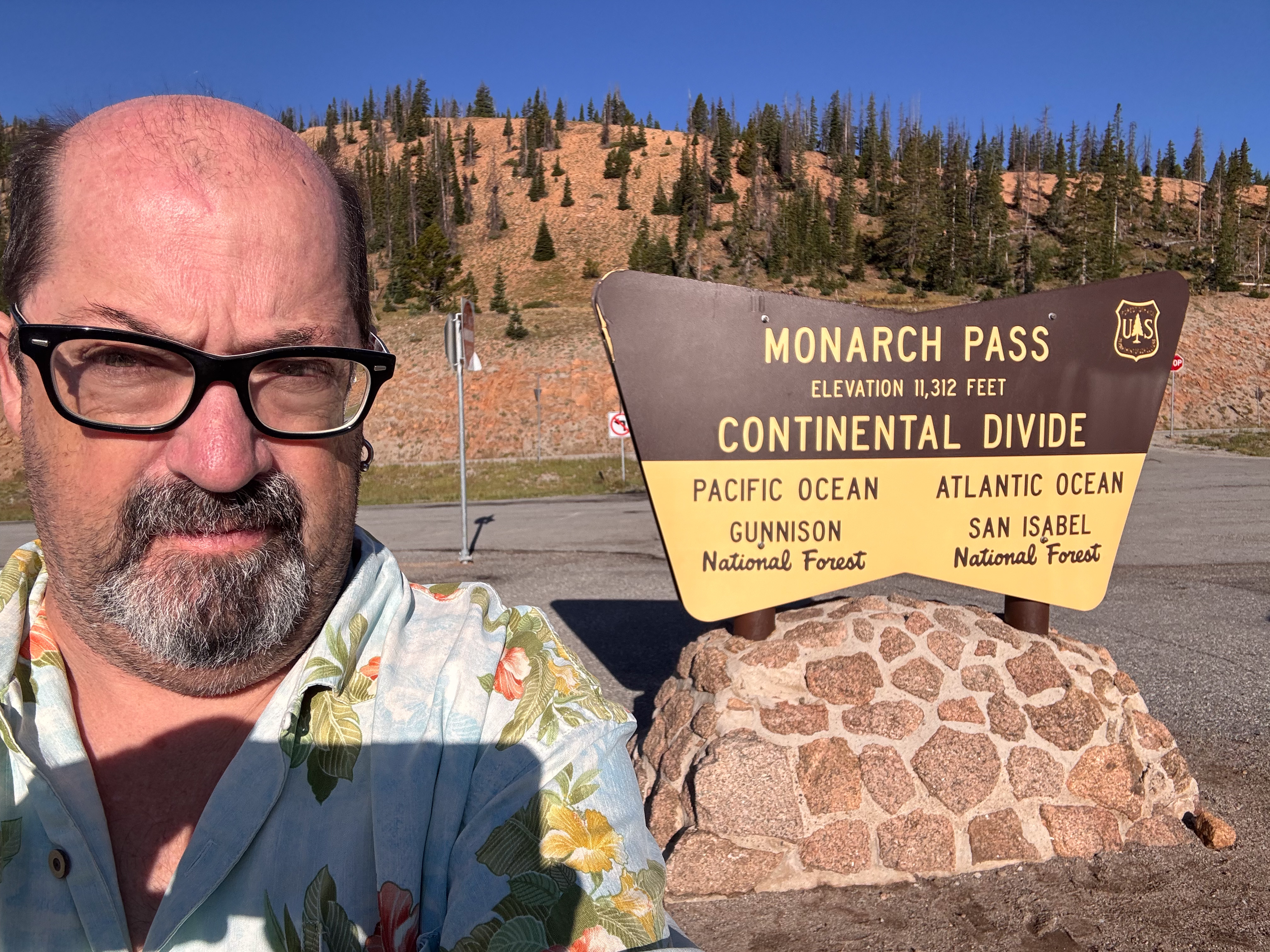 Fred at the Monarch Pass sign, Continental Divide, 11,312 feet.