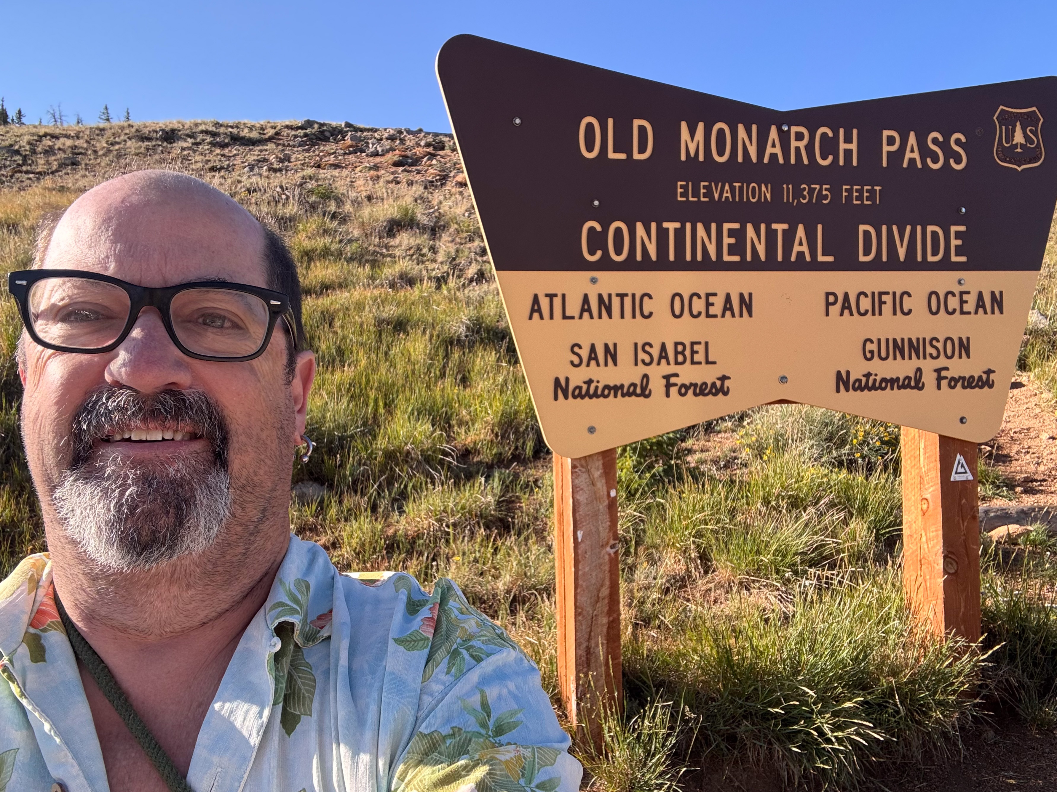 Fred at the Old Monarch Pass sign, Continental Divide, 11,375 feet, ten minutes later.