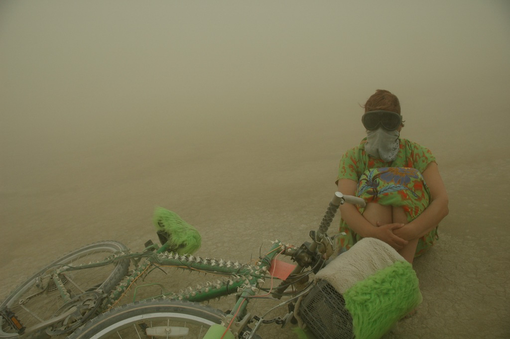 Becke sitting out the dust storm on the playa, BM 2007