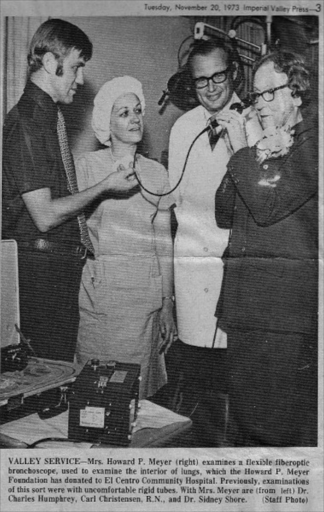 "Mrs. Howard P. Meyer" (right) trying out a fiberoptic bronchoscope donated to El Centro Community Hospital by the Howard P. Meyer Foundation — Imperial Valley Press, November 20, 1973.