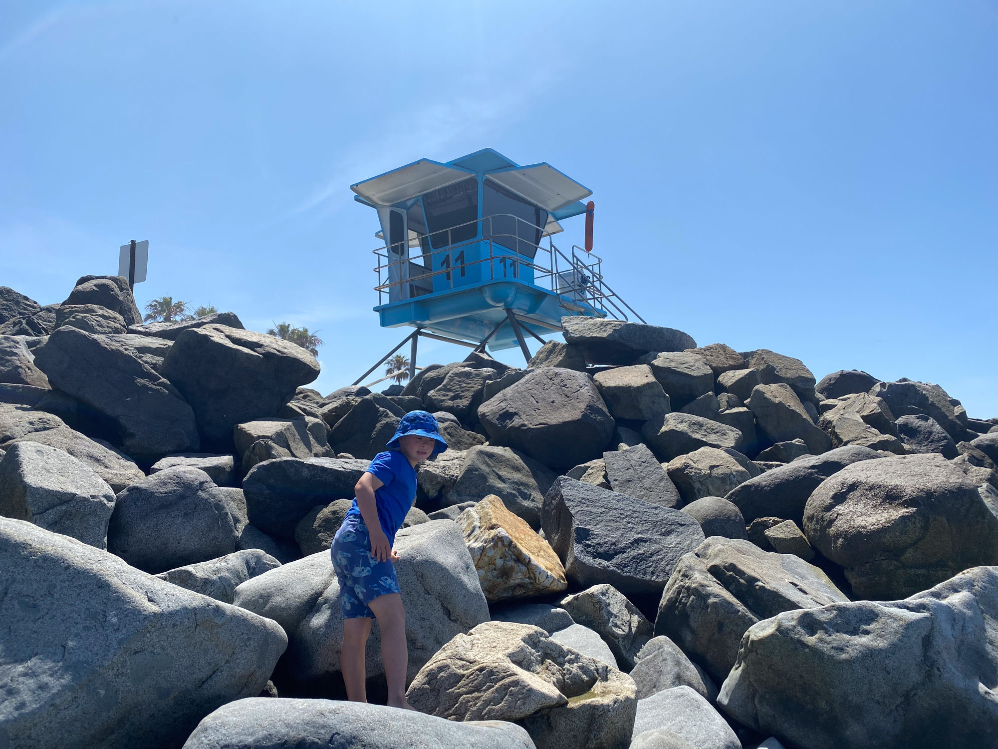 Dylan on the rocks, Tower 11 above.